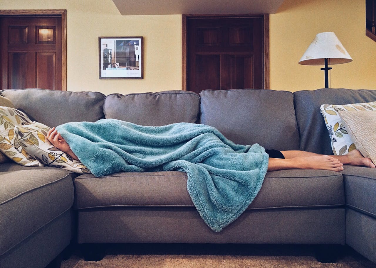 Person Lying on Sofa for a nap